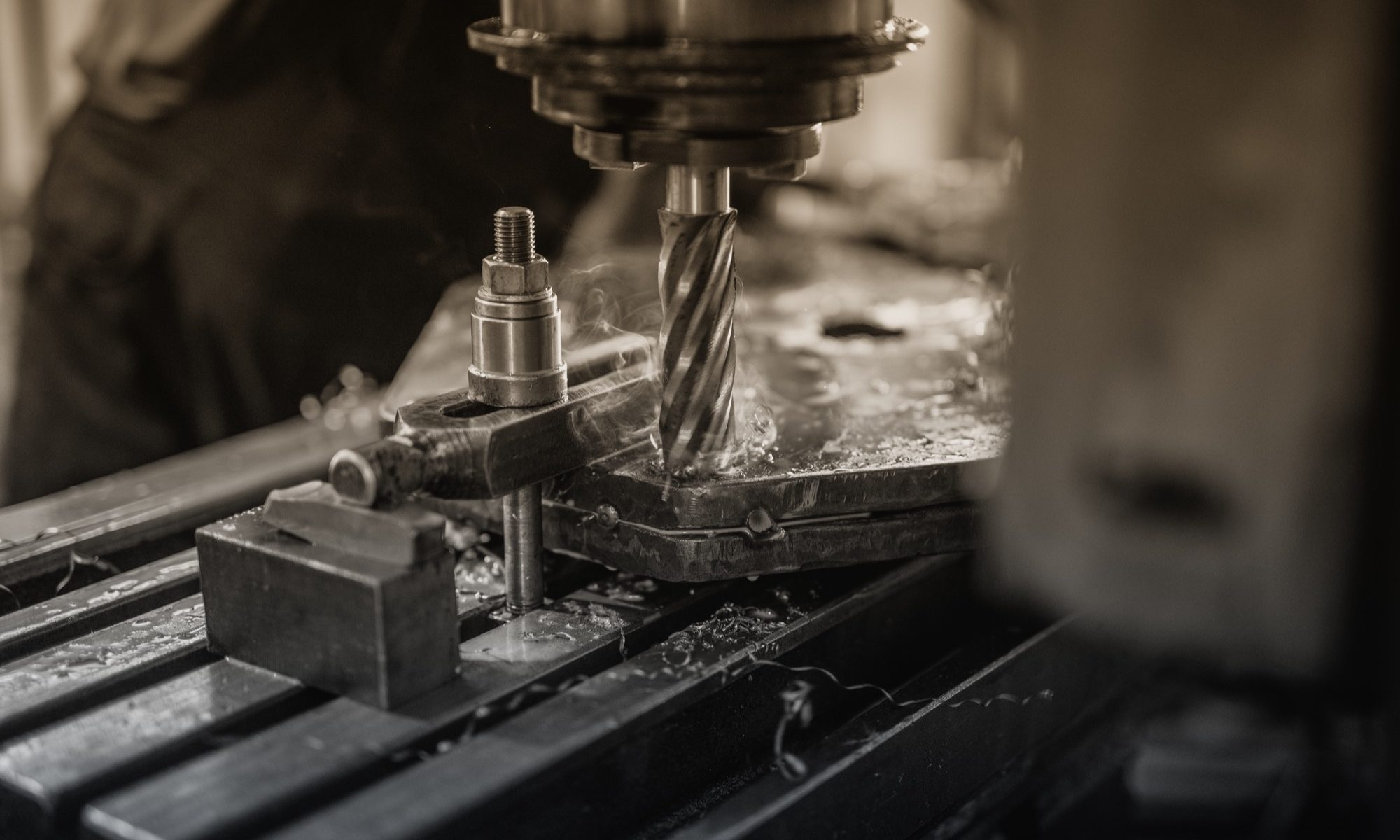 Industrial machine drilling metal.